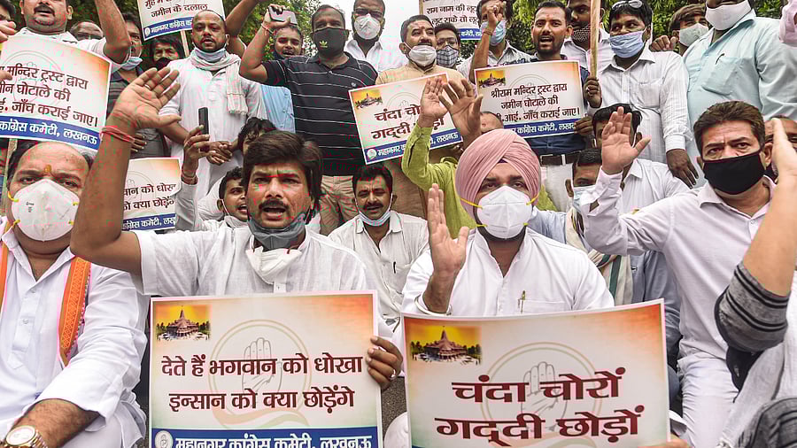 Congress party workers stage a protest against the alleged Ayodhya land purchase scam issue, in Lucknow. Credit: PTI Photo