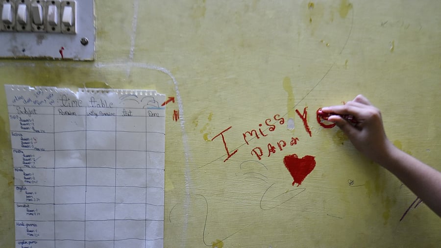 Losing her father to Covid in April, a Class 6 girl selling ready-made shirts outside her house. Credit: PTI File Photo