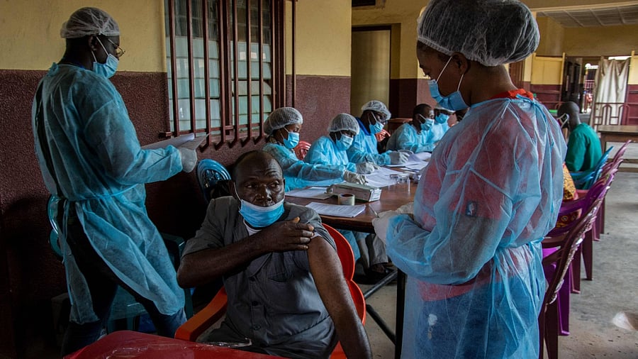 A staff member of the N'zerekore hospital lifts his shirt sleeve as he prepares to get his anti-ebola vaccination in N'zerekore, Guinea. Credit: AFP File Photo