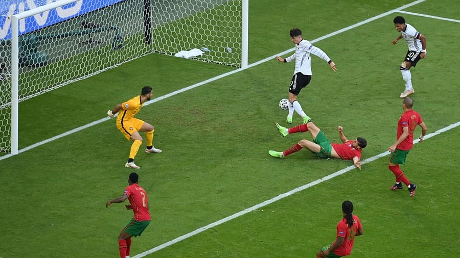 Germany's forward Kai Havertz (top 2R) scores their third goal during the UEFA EURO 2020 Group F football match between Portugal and Germany at Allianz Arena in Munich. Credit: AFP Photo
