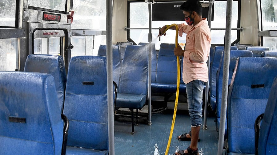 BMTC buses get a thorough wash at the Shanti Nagar depot on Saturday. Credit: DH Photo/Pushkar V