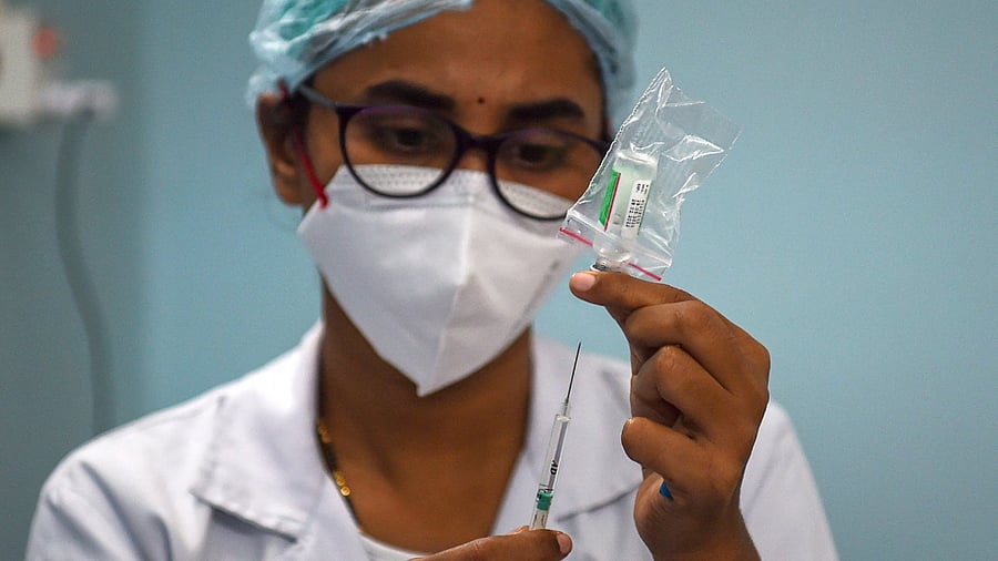 More than 29.35 crore vaccine doses have been provided to states and UTs so far, through Government of India (free of cost channel). Credit: AFP Photo