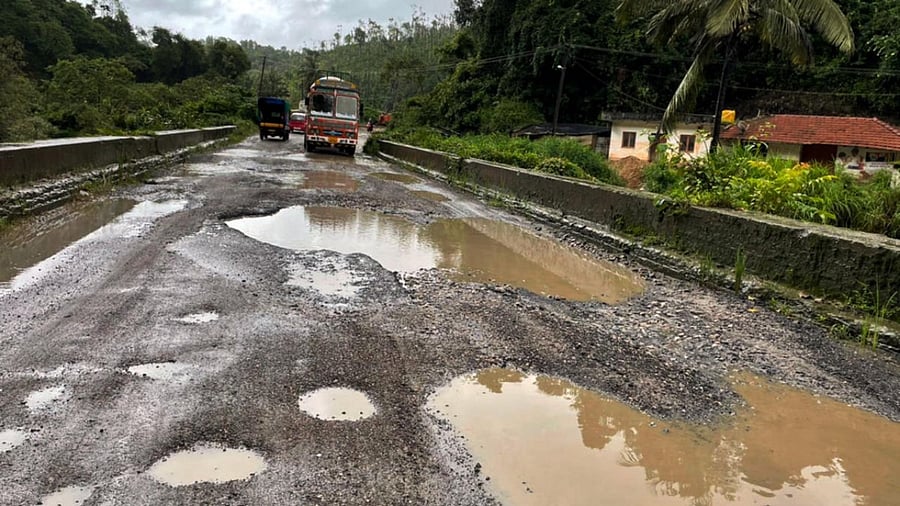<div class="paragraphs"><p>Road users find it difficult to move on Bengaluru-Mangaluru national highway near Yettinahalla village in Sakleshpur taluk due to potholes filled with rainwater. </p></div>