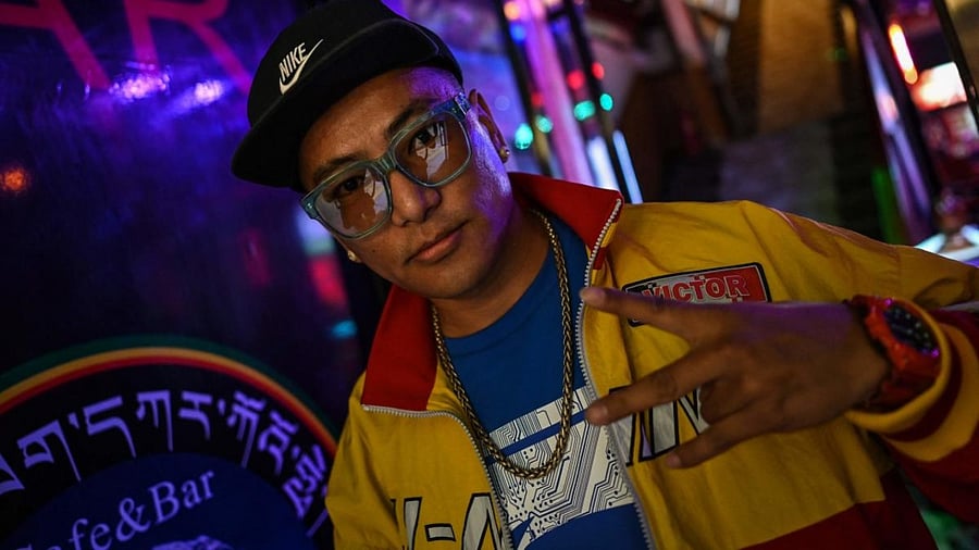 Tibetan rapper Tenzin Dhondup, MC Tenzin, poses for a picture in a bar in the regional capital Lhasa, in China's Tibet Autonomous Region. Credit: AFP Photo