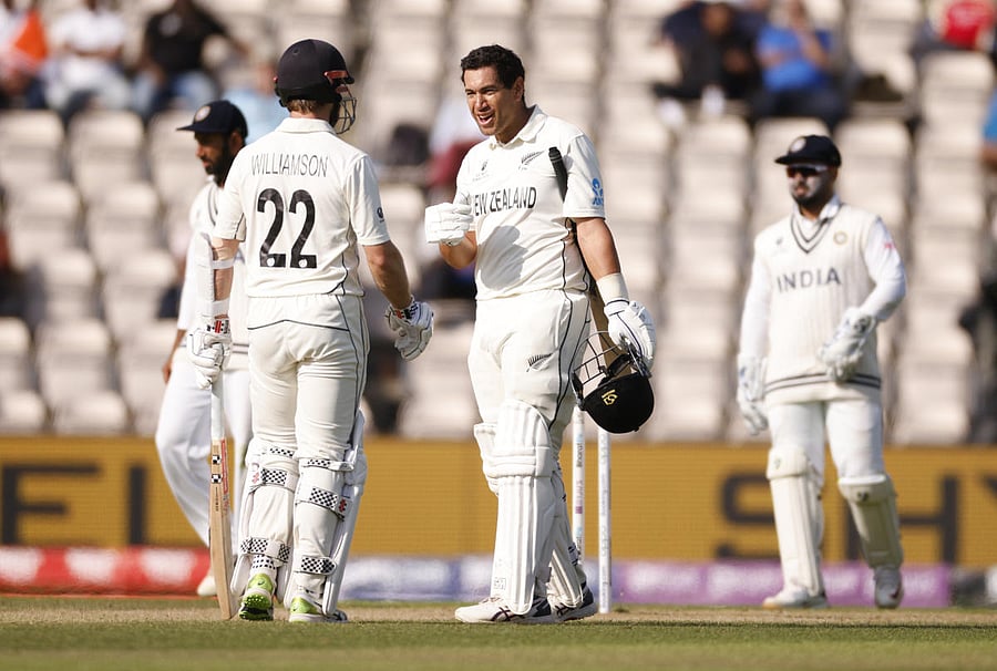 New Zealand's Ross Taylor reacts after getting hit on the helmet by a ball alongside Kane Williamson. Credit: Reuters Photo