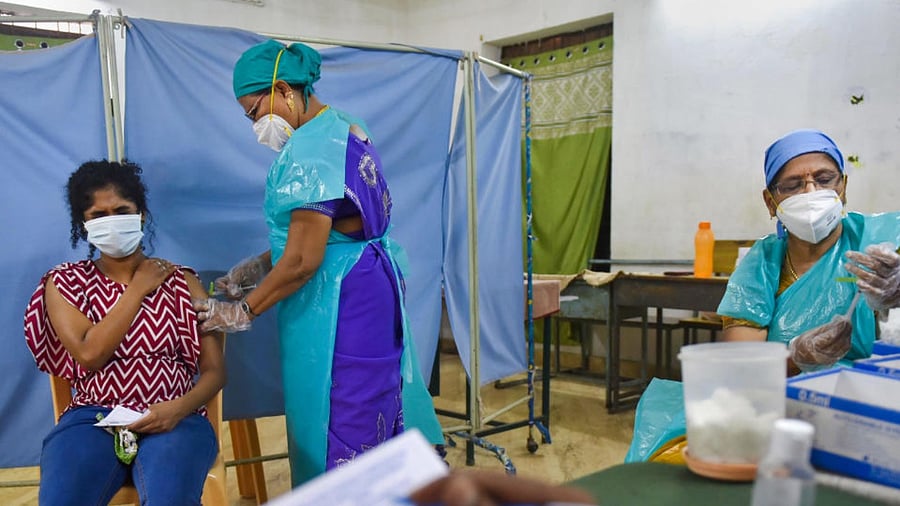  A health worker administers a dose of Covid-19 vaccine to a beneficiary, during a special vaccination drive at a school in Chennai, Wednesday, June 23, 2021. Credit: PTI Photo