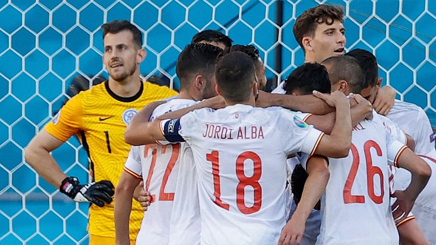Spain's players react after their team's fifth goal during the UEFA EURO 2020 Group E football match between Slovakia and Spain at La Cartuja Stadium in Seville. Credit: AFP Photo