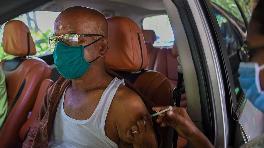 An elderly man gets inoculated with a dose of the Covishield Covid-19 vaccine in Mumbai. Credit: AFP Photo