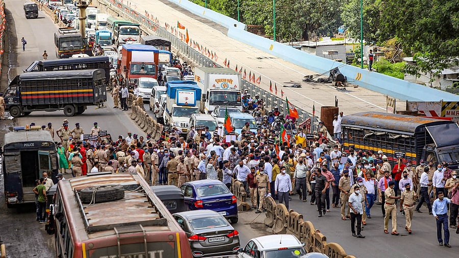 BJP workers stage a Chaka Jam protest on the Eastern Express highway over the issue of reservation for Other Backward Classes, in Thane, Saturday, June 26, 2021. Credit: PTI Photo
