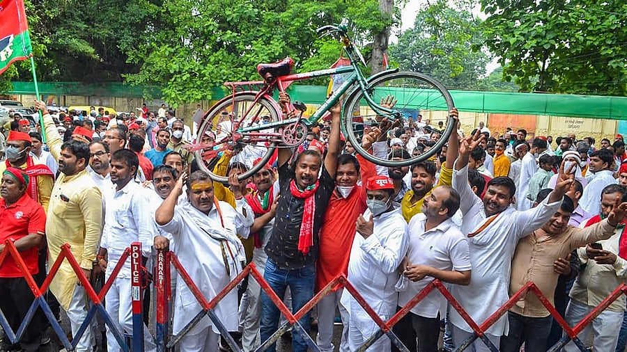 Samajwadi Party supporters violate Covid-19 protocols during the nomination of District Panchayat President, in Varanasi. Credit: PTI Photo