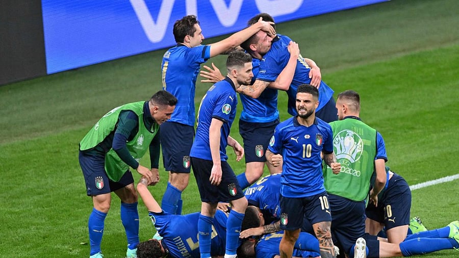 Italy's midfielder Matteo Pessina celebrates with teammates after scoring the team's second goal during extra-time in the UEFA EURO 2020 round of 16 football match between Italy and Austria at Wembley Stadium in London. Credit: AFP Photo
