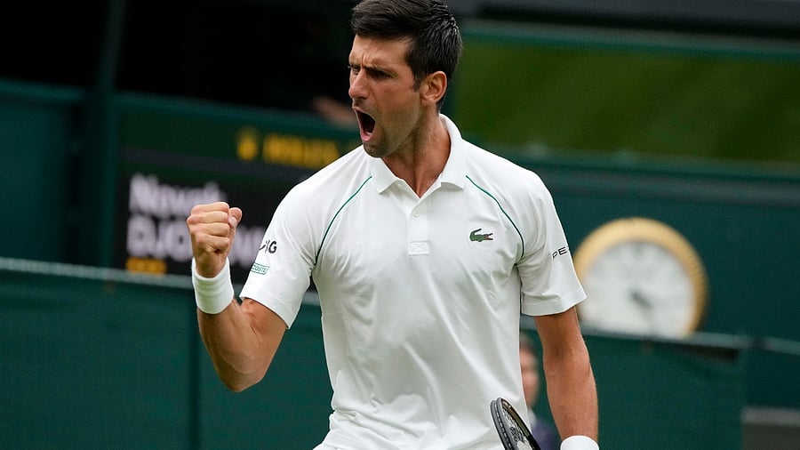 Serbia's Novak Djokovic celebrates during the men's singles match against Britain's Jack Draper on day one of the Wimbledon Tennis Championships. Credit: AP Photo
