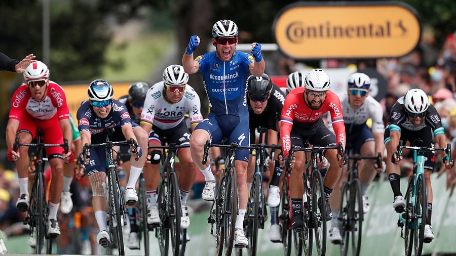 Deceuninck–Quick-Step rider Mark Cavendish of Britain celebrates winning stage 4. Credit: Reuters photo