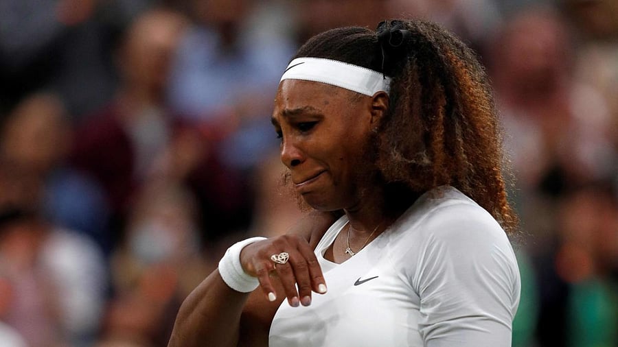 US player Serena Williams reacts as she withdraws from her women's singles first round match against Belarus's Aliaksandra Sasnovich on the second day of the 2021 Wimbledon Championships at The All England Tennis Club in Wimbledon. Credit: AFP Photo
