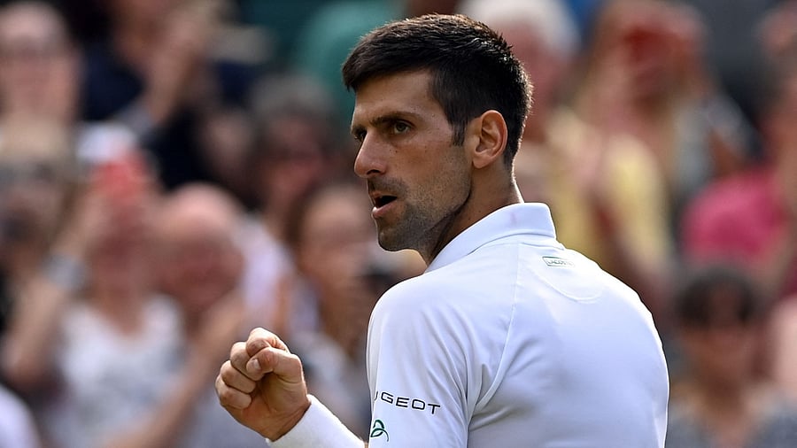 Serbia's Novak Djokovic celebrates his victory against US player Denis Kudla during their men's singles third round match on the fifth day of the 2021 Wimbledon Championships. Credit: AFP Photo