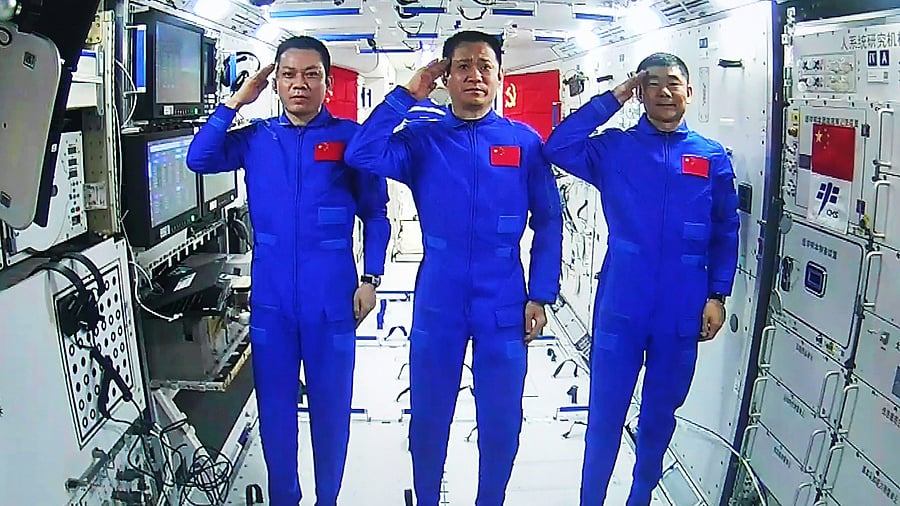 Chinese astronauts, from left; Tang Hongbo, Nie Haisheng, and Liu Boming. Credit: AP Photo