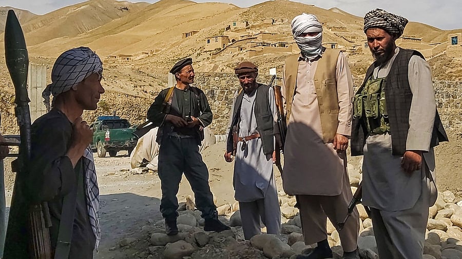 Afghan militia forces stand guard at an outpost as they patrol against the Taliban fighters. Credit: AFP Photo