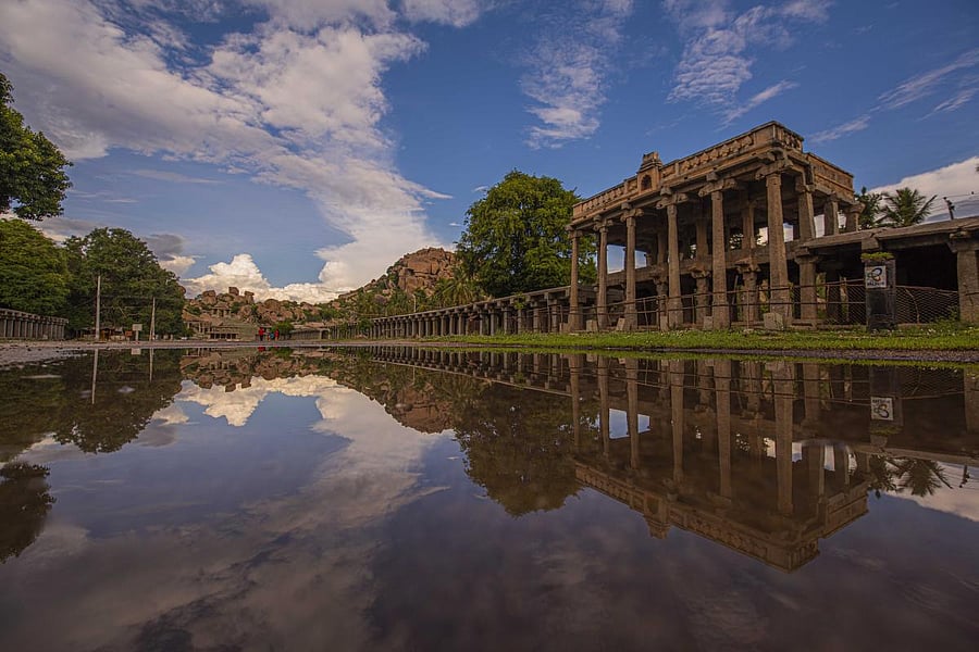The Tuesday night showers flood the famed Ratha Beedhi in front of Virupaksha Temple in Hampi. Credit: DH Photo