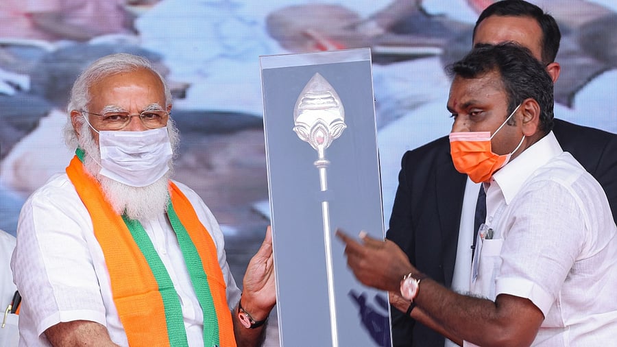 Prime Minister Narendra Modi being presented a memento by Tamil Nadu BJP chief L Murugan. Credit: PTI File Photo