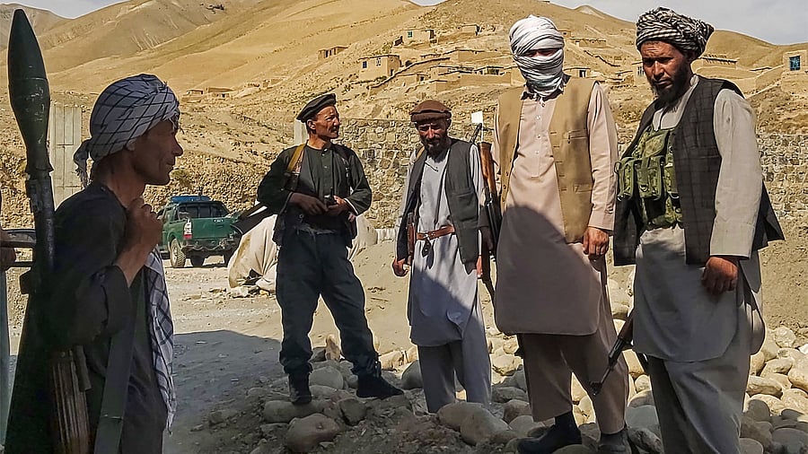 Afghan militia forces stand guard at an outpost as they patrol against the Taliban fighters in the Tange Farkhar area of Taloqan in northern Takhar province. Credit: AFP Photo