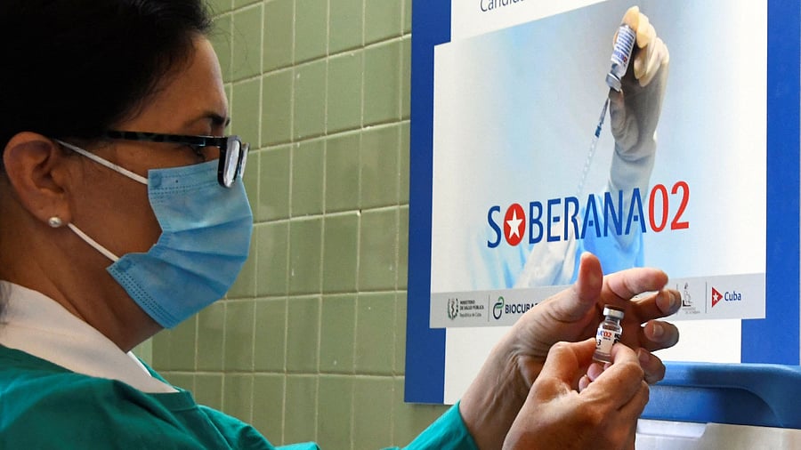 A nurse prepares a Cuban Soberana 2 vaccine candidate to be administered to a volunteer during its trial Phase III in Havana. Credit: AFP Photo