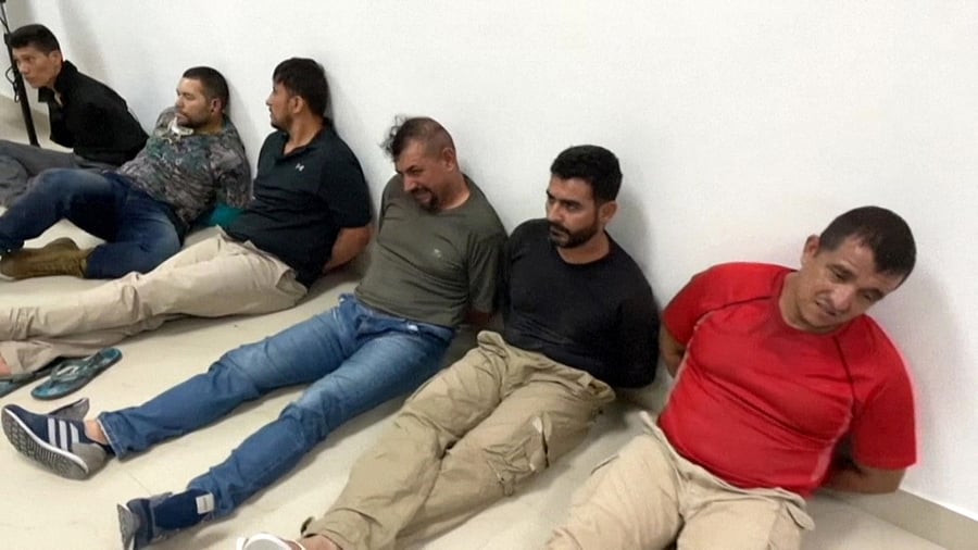 This video grab made on July 9, 2021 from a handout footage obtained from Haiti's Prime Minister offices shows arrested men suspected of being part of the 28-member hit squad believed to be made up of Americans and Colombians who assassinated Haitian President Jovenel Moise. Credit: AFP Photo/ESN/PRIMATURE DE LA REPUBLIQUE D'HAITI