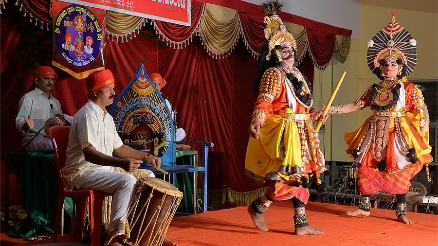 "Yakshagana" artists wearing colourful costumes perform in a theatre in Bengaluru. Credit: AFP Photo