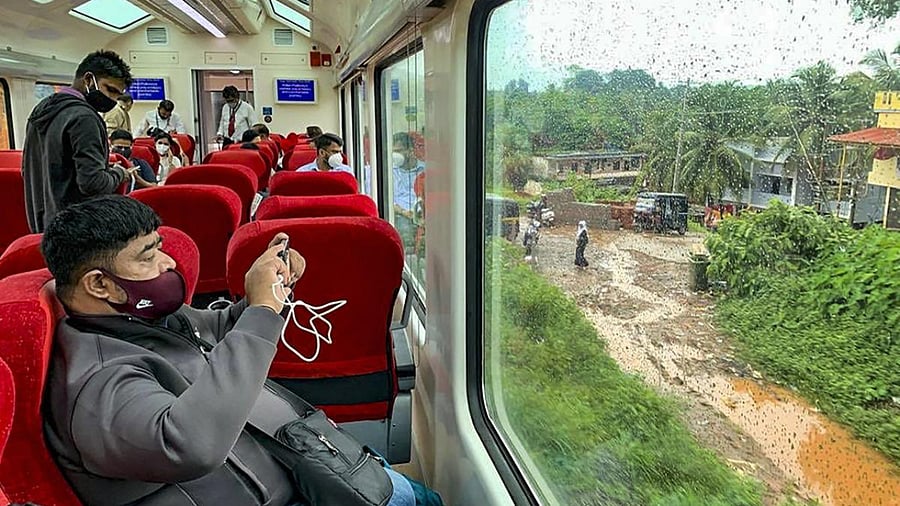 A passenger records a video in South India’s first train with Vistadome coach inaugurated in Mangaluru Junction Railway station. Credit: PTI Photo
