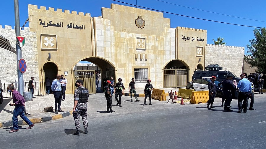 Security members stand guard outside a court that sentenced a former royal confidant, Bassem Awadallah, alongside a minor royal to 15 years in jail on charges of attempting to destabilise the monarchy, in Amman. Credit: Reuters photo