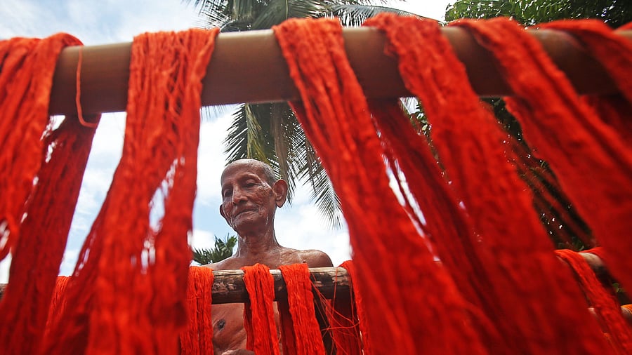 Price of 30s combed yarn has gone up by 43 per cent to Rs 330 a kg in June 2021 from Rs 230 per kg in November 2020. Credit: AFP Photo