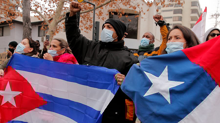 Cuban citizens residing in Chile demonstrate against Cuban President Miguel Diaz-Canel. Credit: AFP Photo