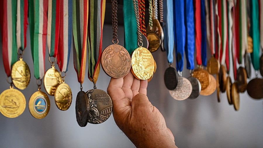 It wasn't until the 1904 St. Louis Games, where the now standard gold, silver, and bronze medals, were first used. Credit: AFP Photo