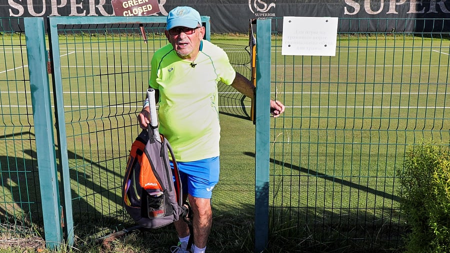 The world's oldest tennis player Ukrainian Leonid Stanislavskyi, 97, practices on court in Kharkiv, Ukraine. Credit: Reuters photo