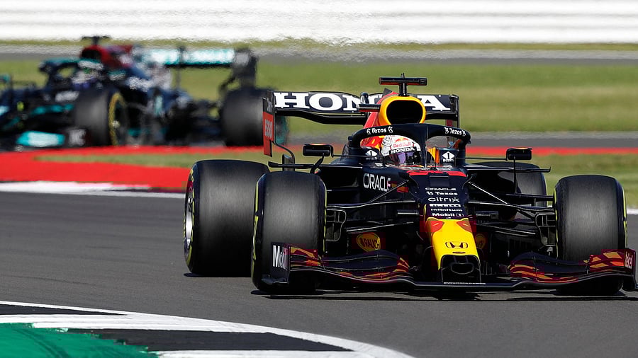 Red Bull's Dutch driver Max Verstappen (R) leads Mercedes' British driver Lewis Hamilton. Credit: AFP Photo