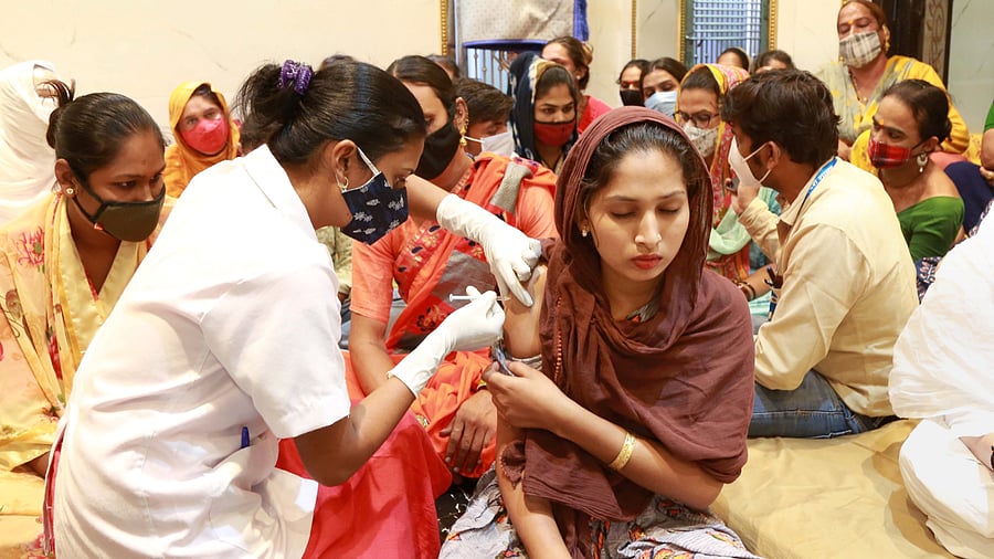 Mandaviya said a total of 18 crore doses of vaccines will be available in August for the vaccination drive. Credit: PTI Photo