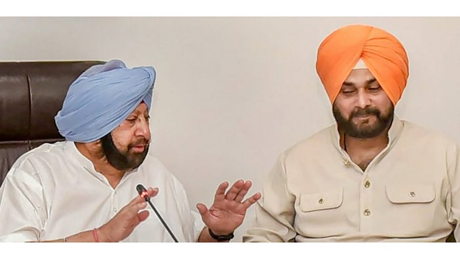 Punjab Chief Minister Captain Amarinder Singh with Navjot Singh Sidhu. Credit: PTI File Photo