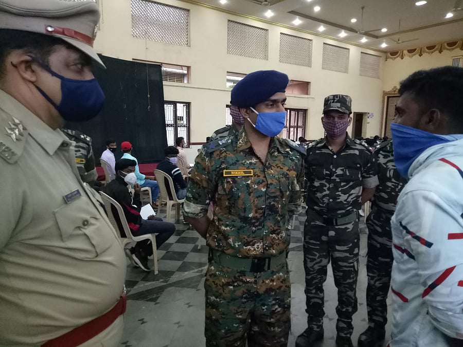 Anti-Naxal Force Superintendent of Police Nikhil B interacts with Sumanth from naxal-affected Neriya village in Beltangady taluk during the competitive examination guidance workshop organised by ANF at St Lawrence Church hall in Attur near Karkala.