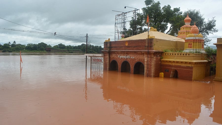 A view of the partially submerged Krishnamai temple due to overflow Koyna-Krishna river following heavy rains, in Karad. Credit: PTI Photo