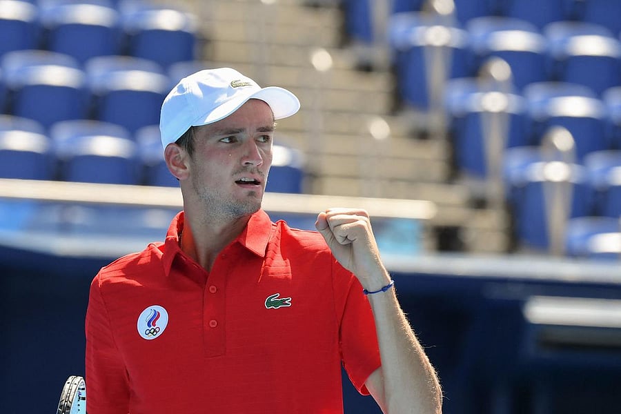 Russia's Daniil Medvedev celebrates a point against Kazakhstan's Alexander Bublik during their Tokyo 2020 Olympic Games men's singles first round tennis match at the Ariake Tennis Park in Tokyo. Credit: AFP Photo