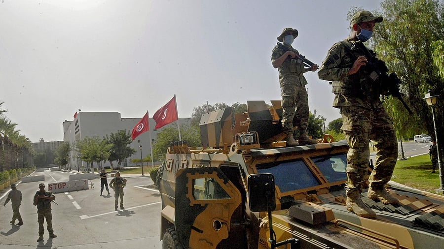 Tunisian military forces guard the area around the parliament building in the capital Tunis. Credit: AFP Photo