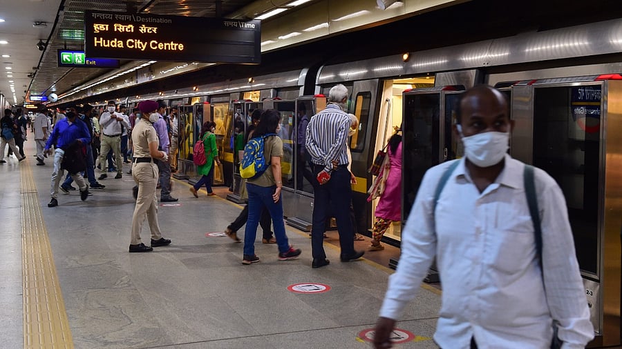 assengers board a metro train after the metro services resumed. Credit: PTI File Photo