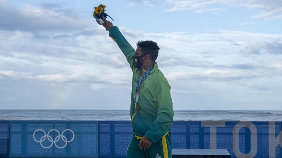 Brazil's Italo Ferreira celebrates at the Tsurigasaki Surfing Beach, in Chiba, on July 27, 2021 during the Tokyo 2020 Olympic Games. Credit: AFP Photo