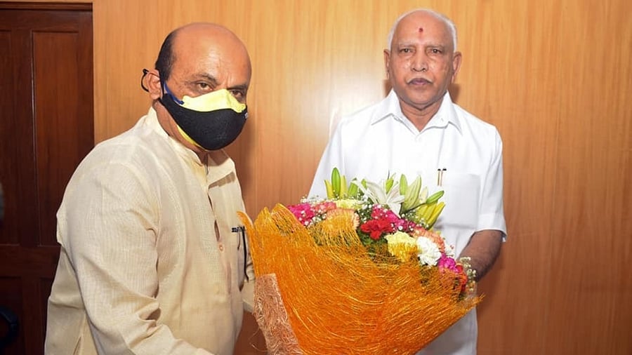 Basavaraj Bommai and B S Yediyurappa. Credit: Special Arrangement