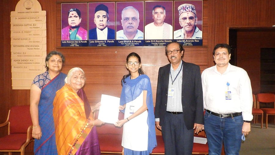 Honorary secretary of GSSS Vanaja B Pandit, CEO R K Bharath, administrative officer Anupama B Pandit and principal M Shivakumar greet B Rachana of GSSS Institute of Engineering and Technology for Women, Mysuru. Credit: DH Photo