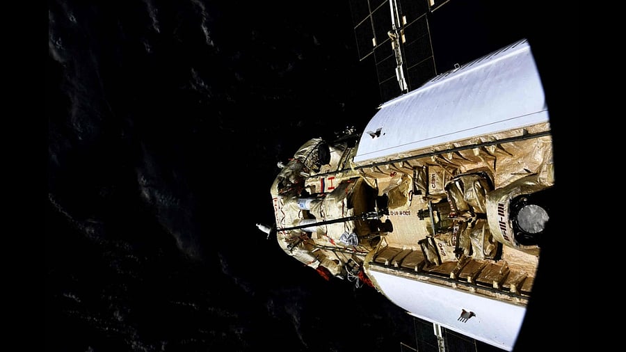 This handout photograph taken and released by the Russian Space Agency Roscosmos on July 29, 2021, shows the Russian Multipurpose Laboratory Module "Nauka" (Science) docking to the International Space Station (ISS). Credit: AFP Photo/Roscosmos
