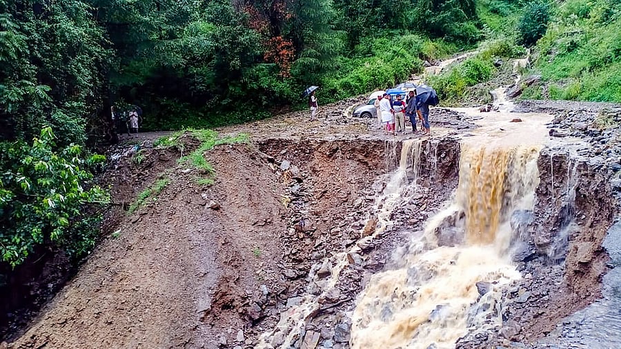 A washed away road following heavy rains, at Kyara Panchayat in Theog near Shimla. Credit: PTI Photo
