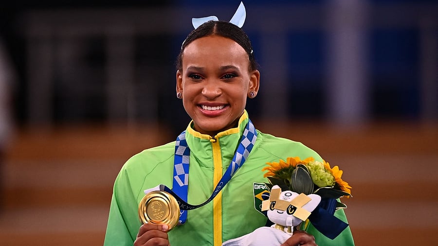 Brazilian Rebecca Andrade poses with her women's vault gold medal. Credit: AFP Photo
