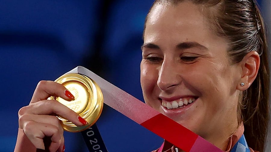 Gold medallist Belinda Bencic of Switzerland celebrates on the podium. Credit: Reuters Photo