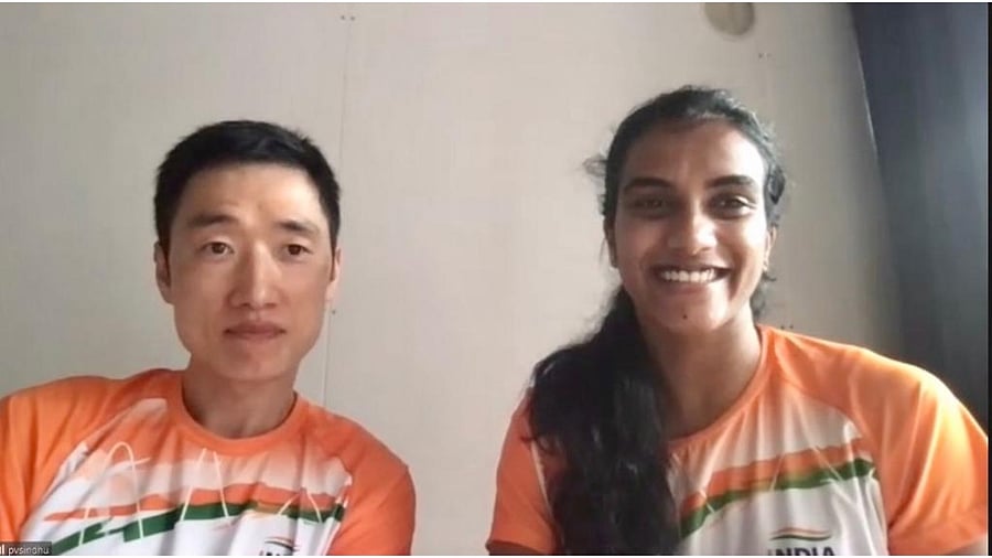 Park Tae-Sang (L) and P V Sindhu. Credit: Twitter/@BAI_Media