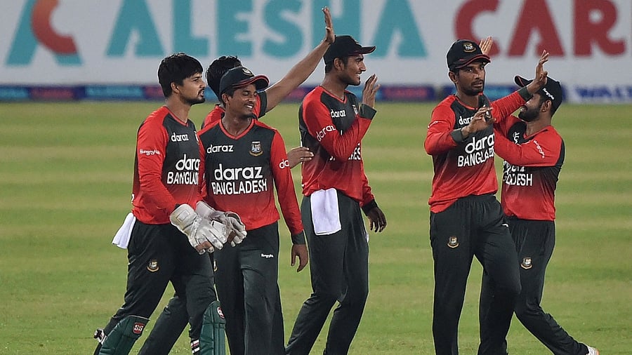 Bangladesh's cricketers celebrate their win in the first T20 international against Australia at the Sher-e-Bangla National Cricket Stadium in Dhaka. Credit: AFP Photo